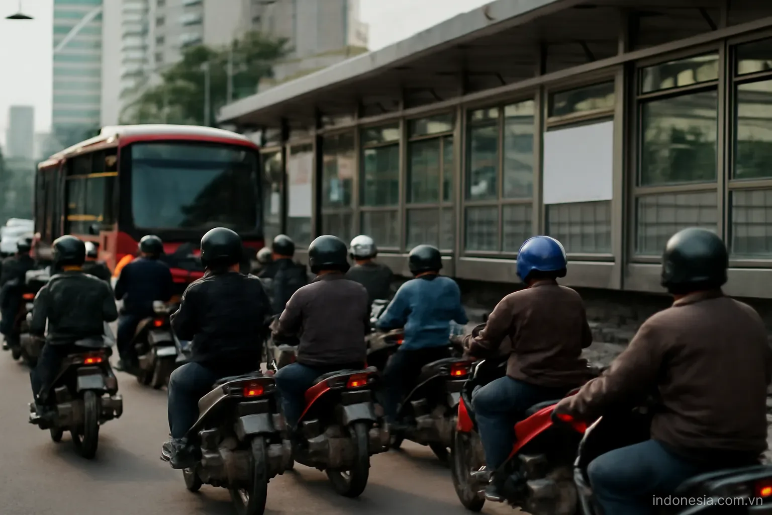 A dense street with motorbikes waiting at a crossing beside a bus rapid transit station, eye level, no text